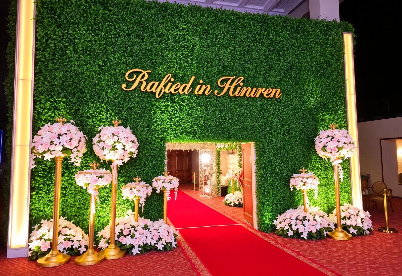Luxury Abuja event entrance with foliage wall